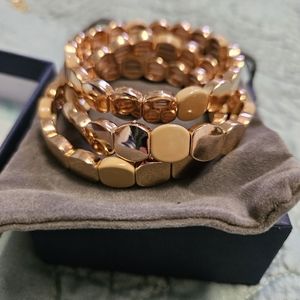 Gold tone stretch bracelets I figurine